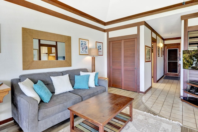 living room featuring light hardwood / wood-style floors and ornamental molding