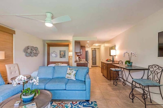 tiled living room with ceiling fan