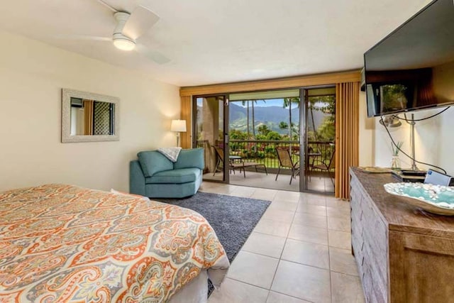 tiled bedroom featuring access to outside and ceiling fan