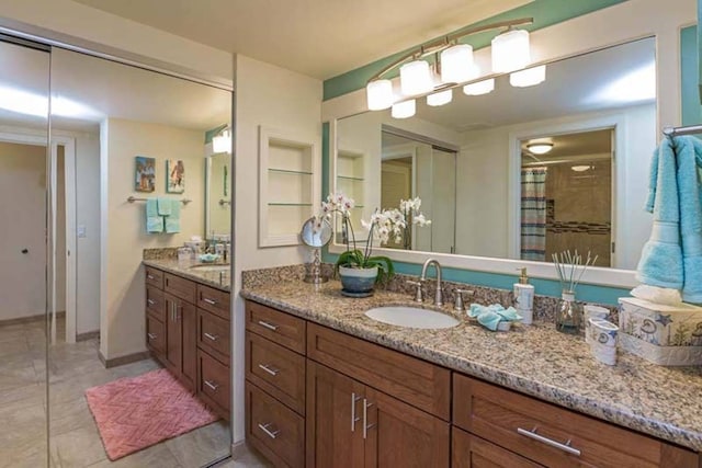 bathroom with vanity, a shower with curtain, and tile patterned floors