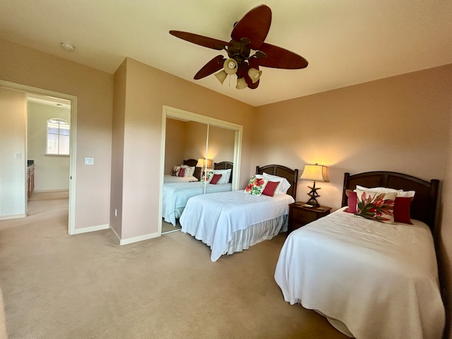 carpeted bedroom featuring ceiling fan