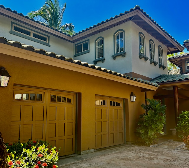 view of property exterior featuring a garage