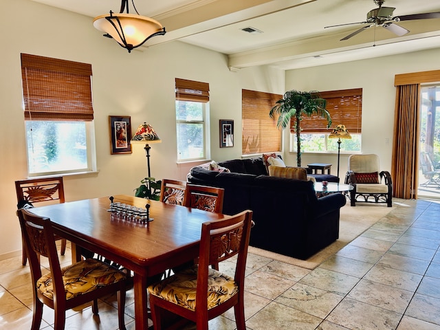 dining area with ceiling fan and beam ceiling