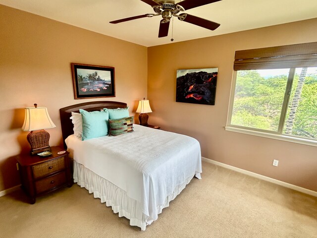 bedroom with light carpet and ceiling fan