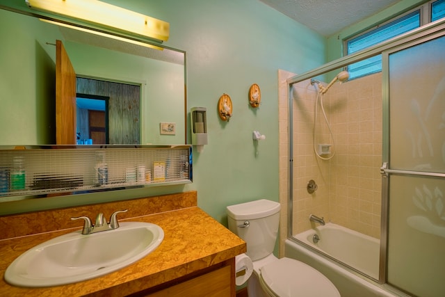 full bathroom with vanity, shower / bath combination with glass door, backsplash, toilet, and a textured ceiling