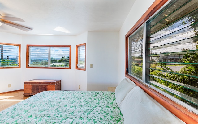 bedroom with hardwood / wood-style flooring and ceiling fan