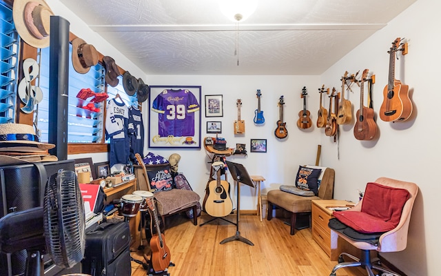 misc room with hardwood / wood-style flooring and a textured ceiling