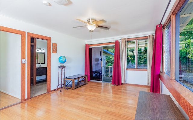 interior space with ceiling fan