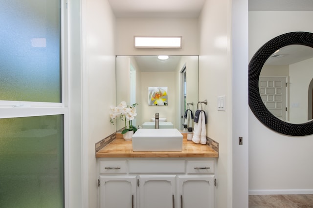 bathroom with vanity and tile patterned flooring