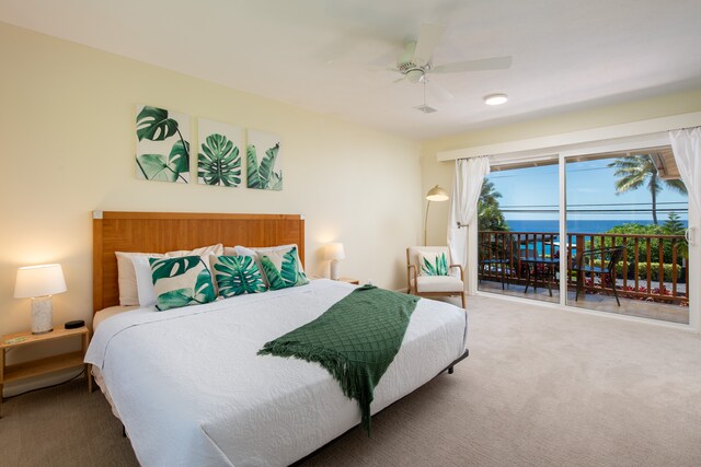 carpeted bedroom with access to outside, a water view, and ceiling fan