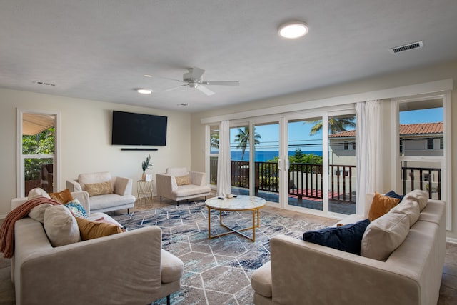 living room featuring hardwood / wood-style flooring and ceiling fan