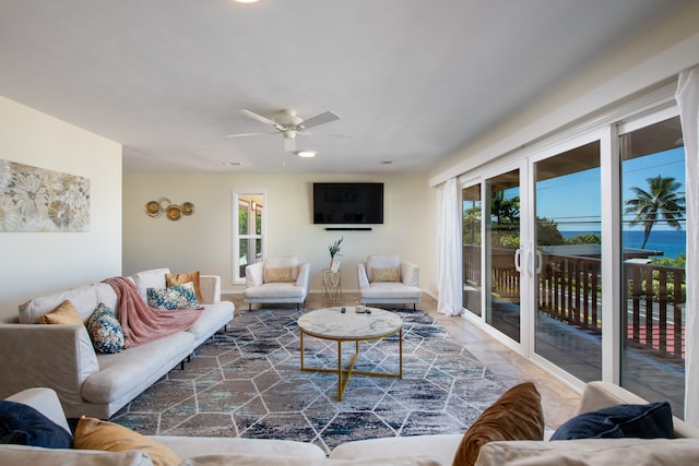 living room featuring a wealth of natural light and ceiling fan