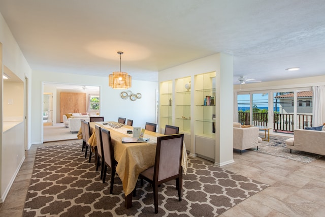 dining room featuring ceiling fan