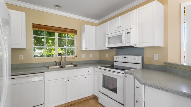 kitchen featuring ornamental molding, white cabinetry, sink, and white appliances