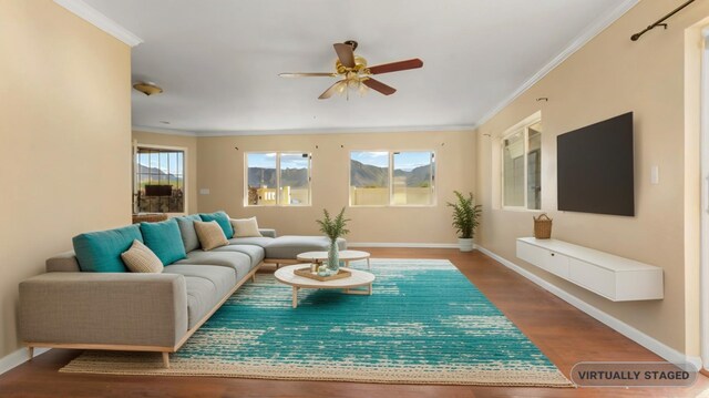 living room featuring ornamental molding, hardwood / wood-style floors, and ceiling fan