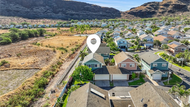 birds eye view of property featuring a mountain view