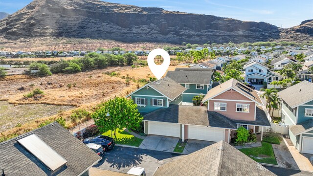 birds eye view of property featuring a mountain view