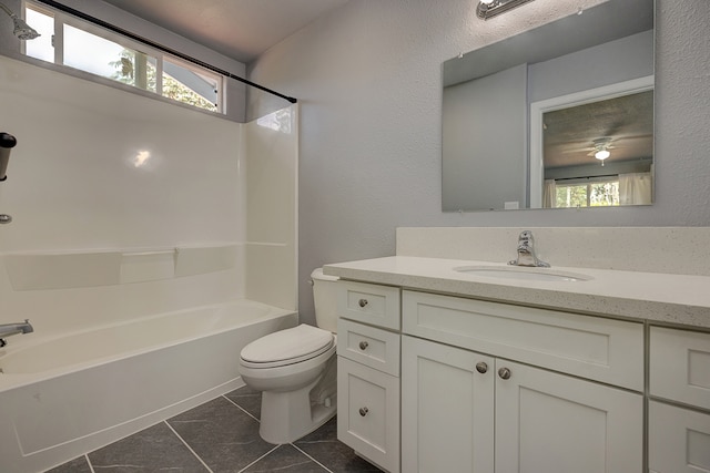 full bathroom featuring vanity, toilet, a healthy amount of sunlight, and bathtub / shower combination