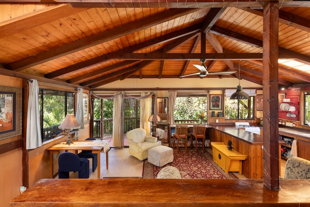 interior space featuring ceiling fan, wood ceiling, and vaulted ceiling with beams