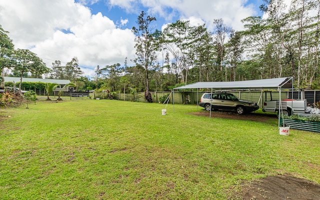 view of yard with a carport