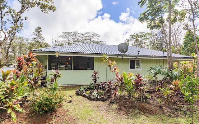 rear view of house with a sunroom