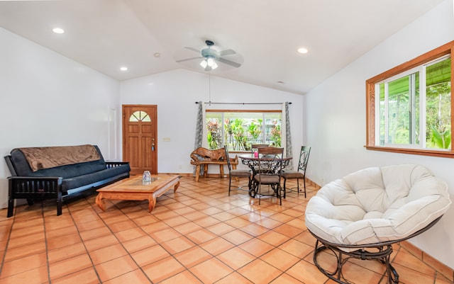 tiled living room featuring ceiling fan and lofted ceiling