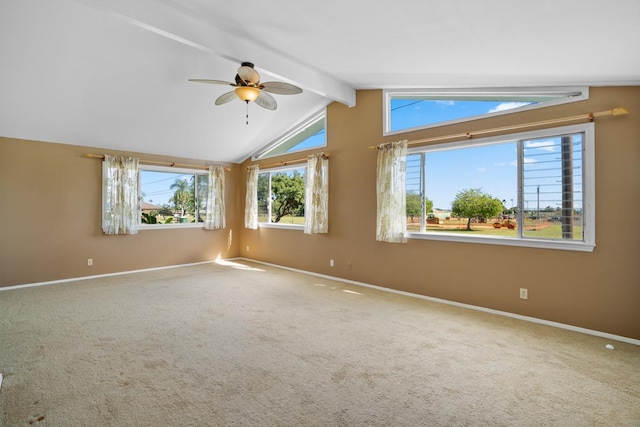 empty room featuring carpet flooring, vaulted ceiling with beams, and ceiling fan