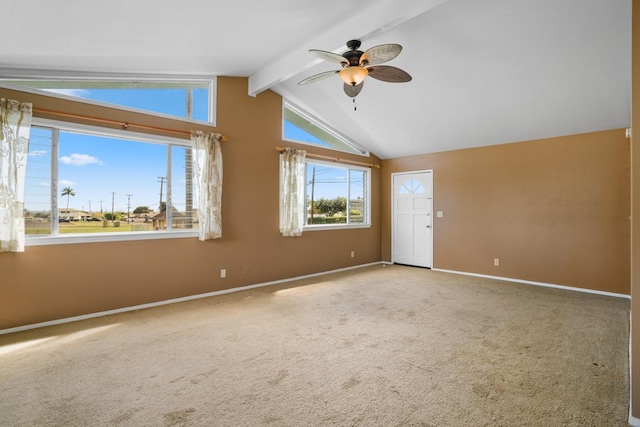 empty room with vaulted ceiling with beams, ceiling fan, and carpet