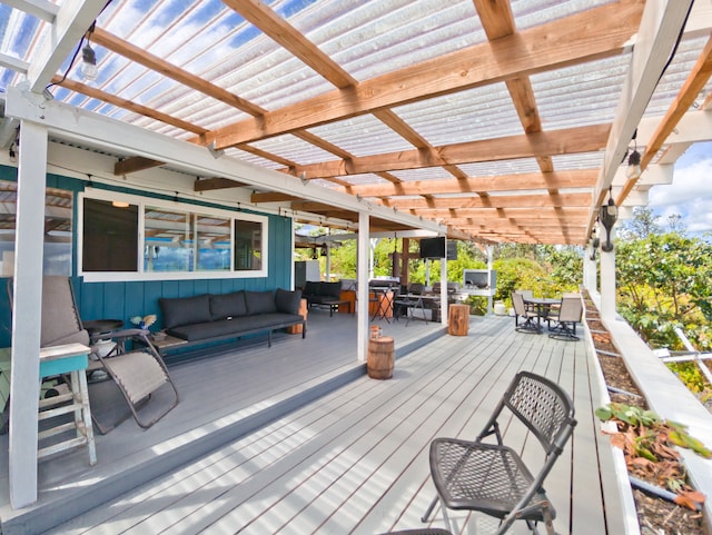 wooden terrace featuring an outdoor hangout area