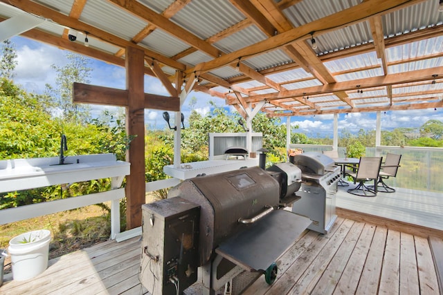 wooden terrace with a grill