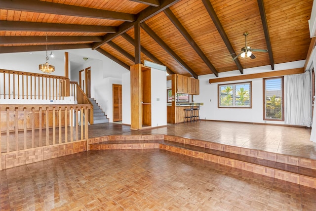 unfurnished living room with high vaulted ceiling, beamed ceiling, wooden ceiling, parquet floors, and ceiling fan with notable chandelier