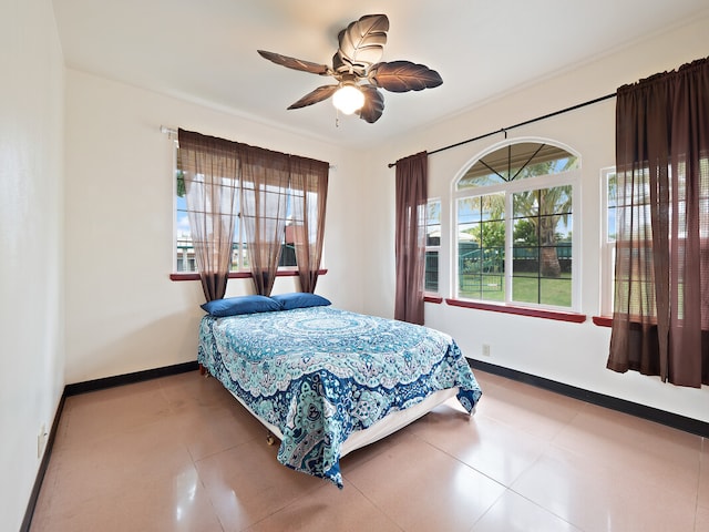 tiled bedroom with ceiling fan