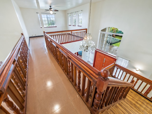 interior space featuring an inviting chandelier and a high ceiling