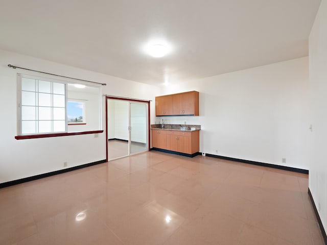 spare room with light tile patterned floors