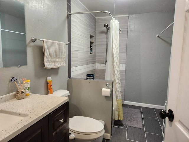 bathroom with vanity, tile patterned flooring, toilet, and curtained shower