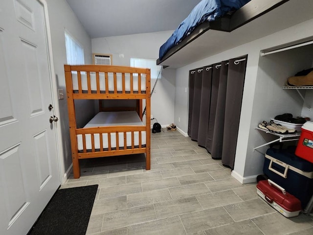 bedroom with vaulted ceiling