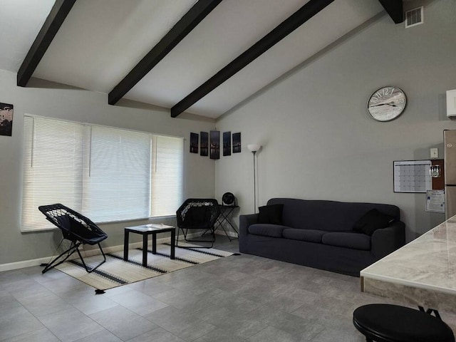 living room with vaulted ceiling with beams