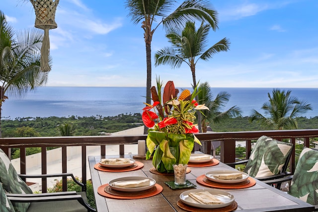 balcony featuring a water view