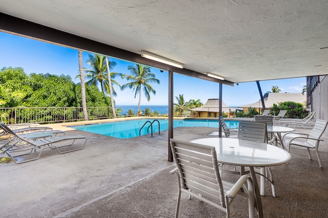 view of pool featuring a patio