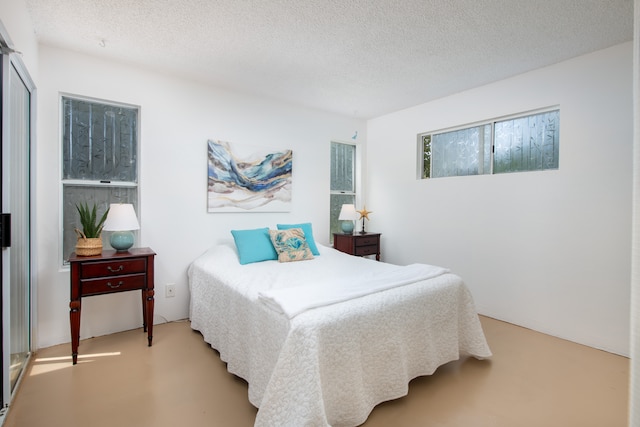 bedroom featuring a textured ceiling