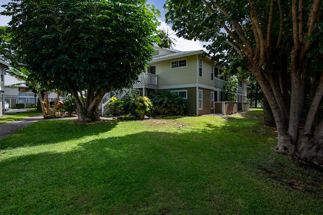 view of yard featuring a balcony