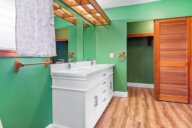 bathroom featuring hardwood / wood-style floors and vanity