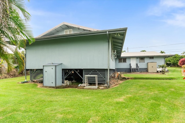 rear view of house with a yard