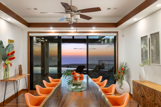 dining area with ceiling fan and dark hardwood / wood-style floors