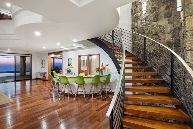 stairway featuring hardwood / wood-style floors