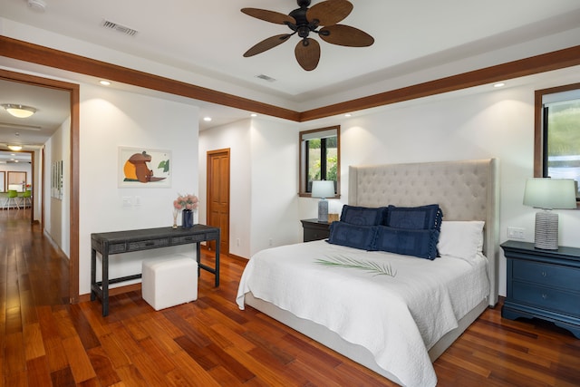 bedroom with dark wood-type flooring and ceiling fan