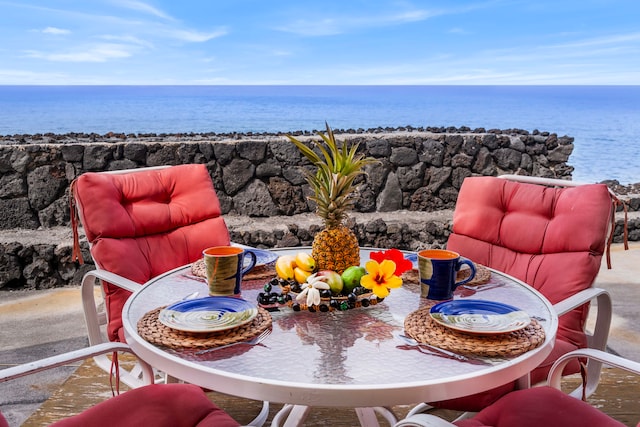 view of patio with a water view