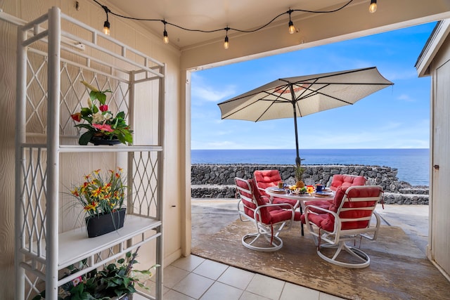 view of patio / terrace with a water view