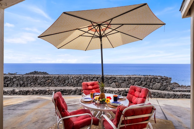 view of patio with a water view