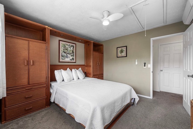 carpeted bedroom featuring ceiling fan, a wall mounted air conditioner, and a textured ceiling